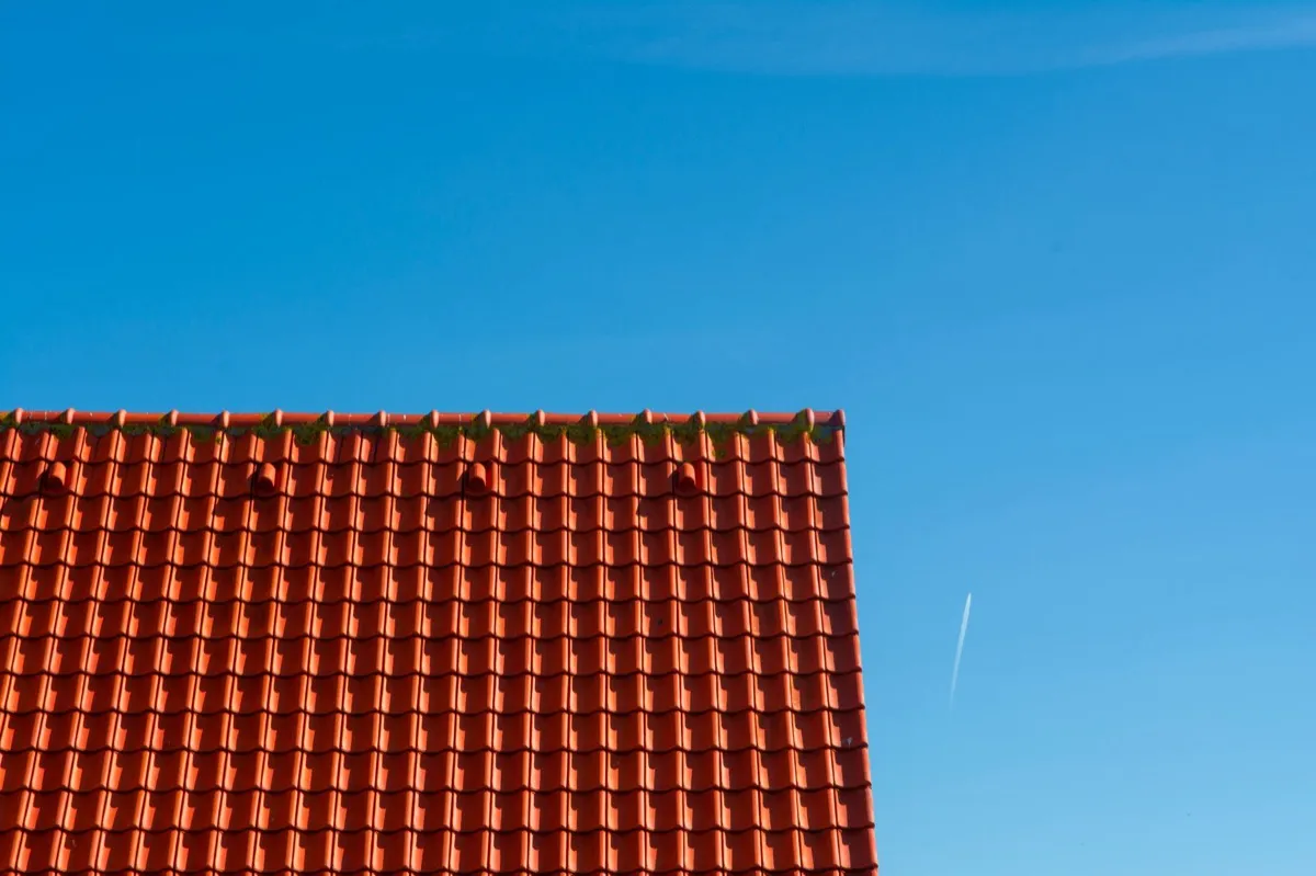 Tile roof gable in full sun, the kind of exposure that sets roof life in Pasadena, TX